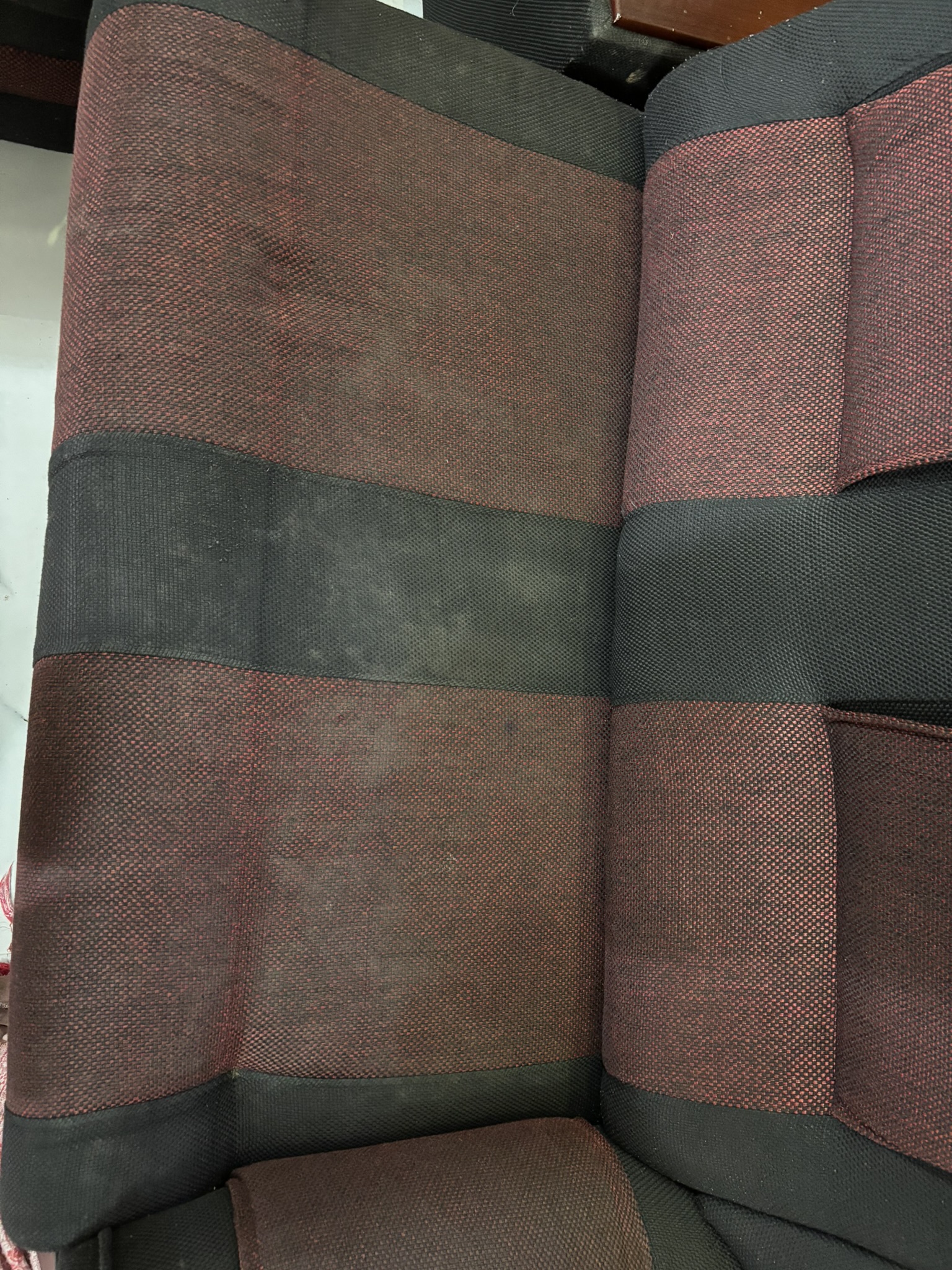 Sofa before professional cleaning — stained fabric